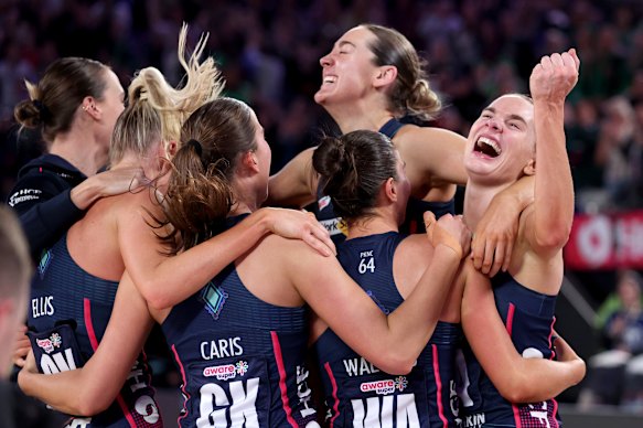 Kiera Austin and her teammates celebrate winning the Super Netball grand final in 2025.
