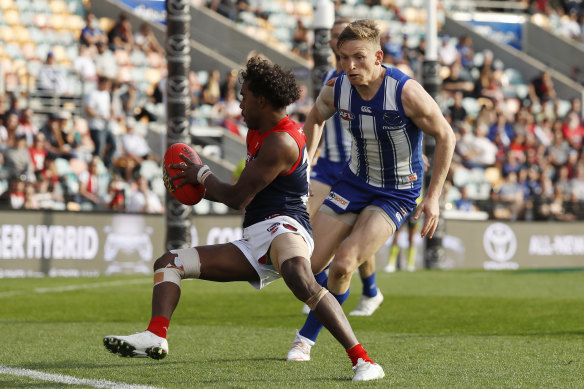 Pickett evades North’s Jack Ziebell. Former Demon stalwart Aaron Davey is a big fan. 