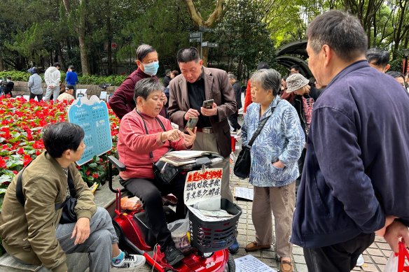 Parents consult a matchmaker at the marriage market in Shanghai’s People’s Park. 