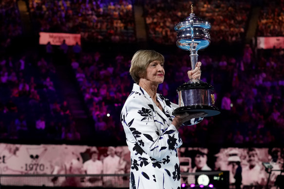Margaret Court with her replica trophy during Monday's ceremony to mark the 50th anniversary of her grand slam win.