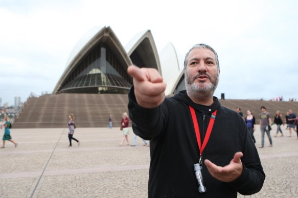 Tunick in 2010 at the Sydney Opera House. The photographer was arrested five times early in his career for assembling thousands of naked participants for his work.