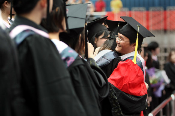 Chinese students at a graduation ceremony in Shanghai. Australia and US universities got fewer students from China since the start of the pandemic.