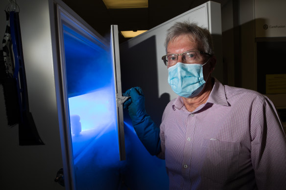 Barwon Health director of pharmacy Greg Weekes with the freezer that will contain the Pfizer vaccines. 