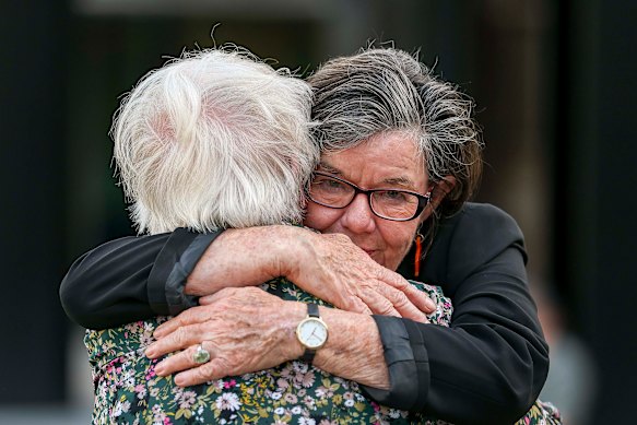 Former independent member for Indi Cathy McGowan embraces a community member on Wednesday.