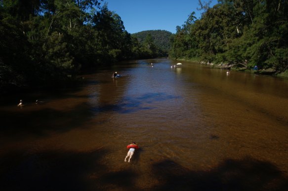 Police have been told the man was with five others on separate inflatable lilos when he became wedged on a large submerged rock about 1pm at Colo River.