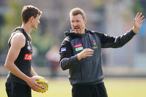 Collingwood coach Nathan Buckley (right) says the squad is as good as it has been all season. 