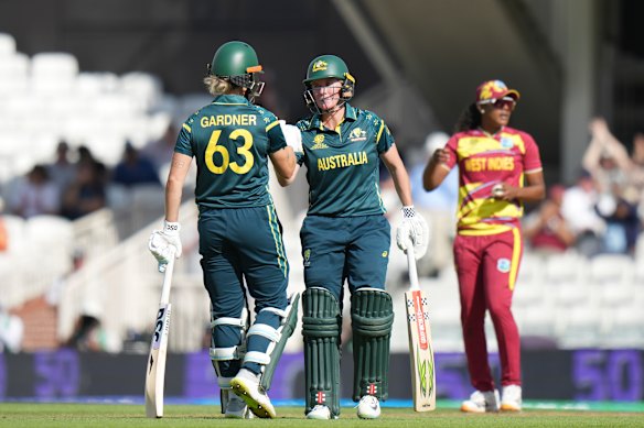 Australia’s Beth Mooney, right, celebrates her 50 runs with Ash Gardner.