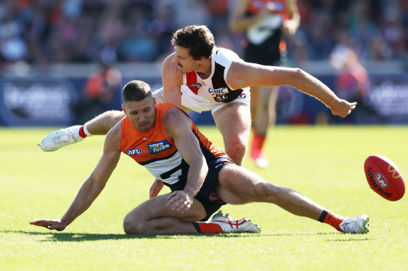 Jesse Hogan of the Giants is challenged by Zaine Cordy of the Saints.