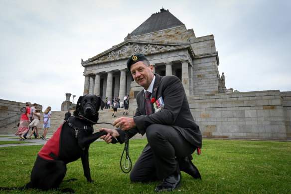  Veteran James Farquharson was accompanied by his service dog, Peggy, during a Remembrance Day ceremony at the Shrine.