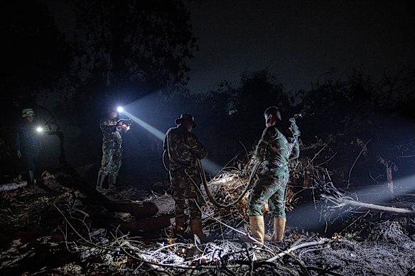 Indonesian soldiers took a moment’s rest after extinguishing a fire in the peatland area. But more fires raged elsewhere.