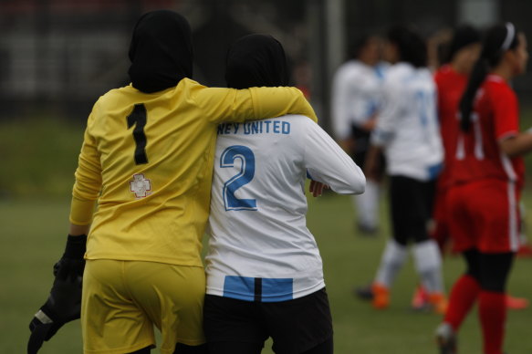 The beautiful game ... Sydney teammates share a moment post-match.