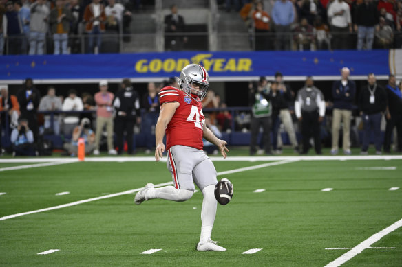 Joe McGuire punting for Ohio State University in January.