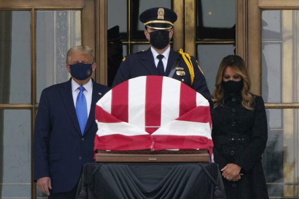 US President Donald Trump and first lady Melania Trump pay respects as Justice Ruth Bader Ginsburg lies in repose at the Supreme Court.