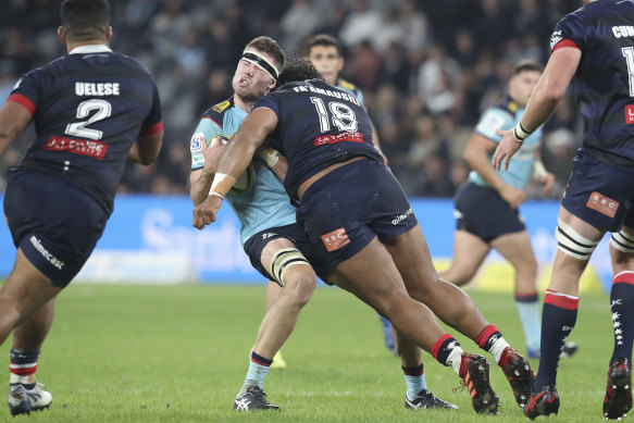 Max Douglas takes the full force of a high tackle from Pone Fa’amausili, which led to a red card.