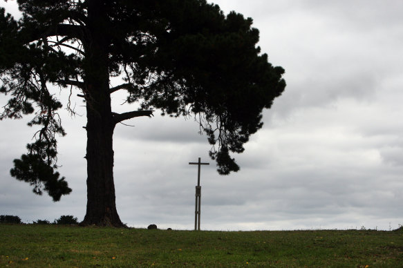 A cross stands on the site of the Lake Condah Mission’s church, destroyed in 1957. 