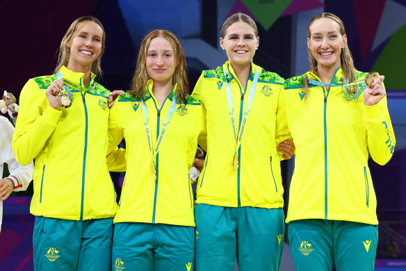 Emma McKeon (left) poses with her 10th Commonwealth Games gold medal alongside her relay teammates Mollie O’Callaghan, Shayna Jack and Madi Wilson.