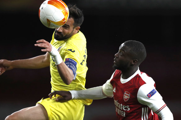 Mario Gaspar rises above Arsenal’s Nicolas Pepe.