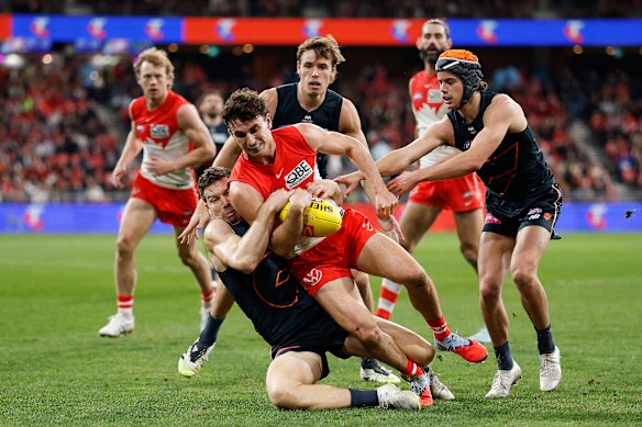 Toby Greene of the Giants tackles Sam Wicks of the Swans.
