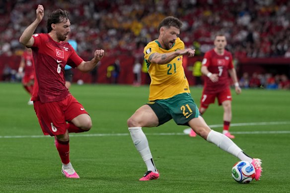 Socceroos defender Cameron Burgess in action against Turkey.
