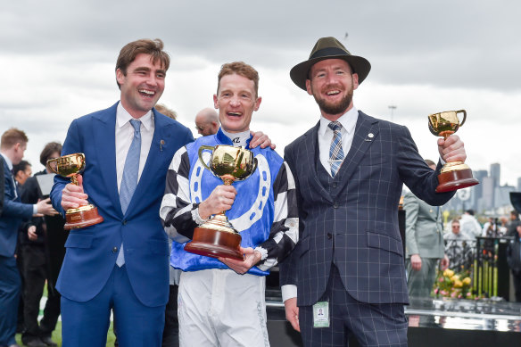 Eustace (left) and Maher with jockey Mark Zahra after their Melbourne Cup win.