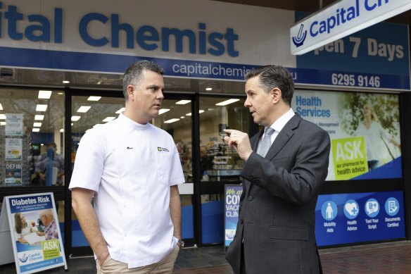 Trent Twomey, left, the national president of the politically powerful Pharmacy Guild of Australia speaks with the Health Minister last year.