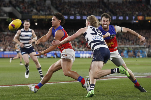 Brisbane’s Cam Rayner gets a   handball away.