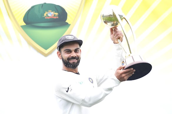 Virat Kohli poses with the Border-Gavaskar trophy in 2019.
