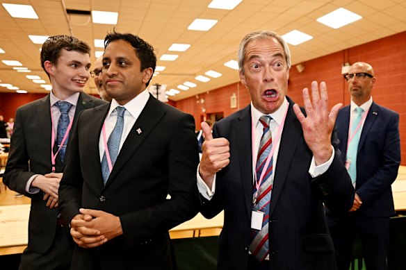 Nigel Farage celebrates after his Reform Party wins a byelection in the UK.