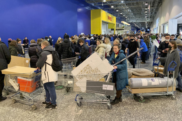 People queue at an IKEA store outside Moscow after the company said it was closing all of its stores in Russia.