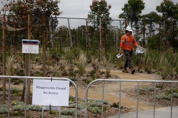 Employees of John Holland and CPB contractors collect asbestos samples for the EPA (Environmental Protection Authority) after asbestos was found in the mulch. 