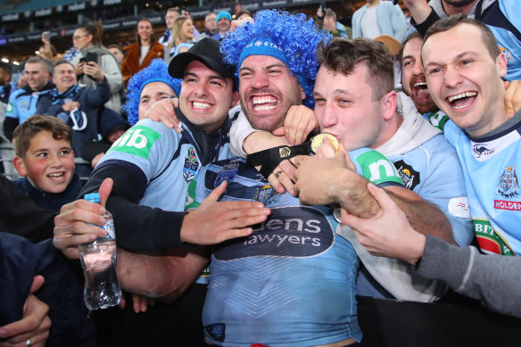 James Tedesco celebrates with fans after NSW's series victory last year.