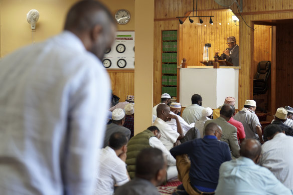 An imam leads Friday prayers at the Dar Al-Hijrah mosque in Minneapolis. During the pandemic lockdown in spring 2020, the mosque was given a special permit to broadcast the prayer for the Muslim holy month of Ramadan. 