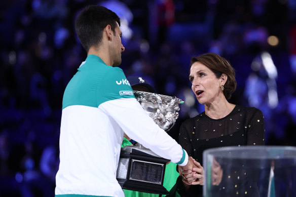 Tennis Australia chair Jayne Hrdlicka awards Novak Djokovic his ninth Australian Open trophy in 2021.