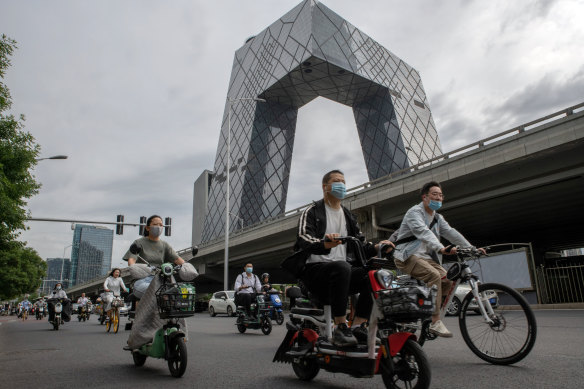 Motorists travel past the China Central Television (CCTV) Tower in Beijing, China. It’s been dubbed the “Big Pants”.