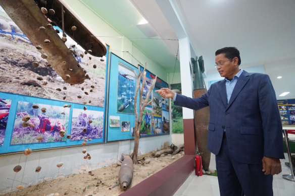Heng Ratana with cluster bombs on display at CMAC headquarters in Phnom Penh.