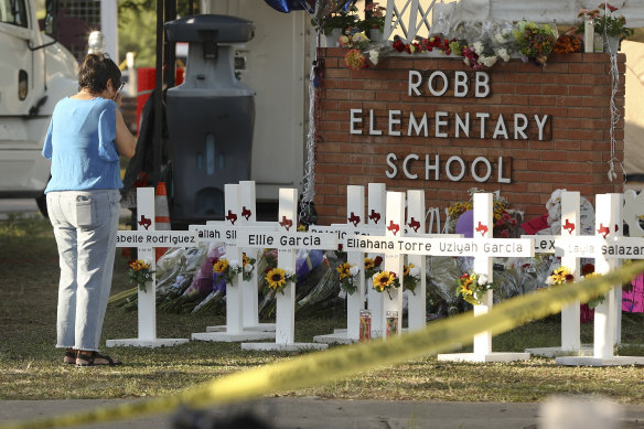 Dora Mendoza, grandmother of victim Amerie Jo Garza, wipes her tears at a memorial site for victims of the Robb Elementary School shooting at Uvalde, Texas.