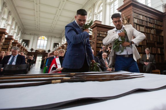 Indigenous Australians from Sydney’s La Perouse community at Trinity College, Cambridge, to retrieve the four spears taken by Captain Cook.