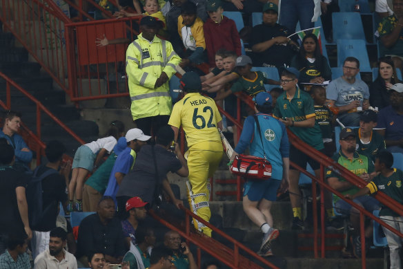 Australia’s Travis Head leaves the field after receiving medical attention during the fourth ODI cricket match between South Africa and Australia.