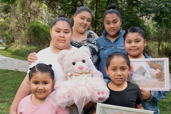 Jennifer Fonua with her five children and the teddy bear that contains her baby daughter Thalia's ashes. (L-R) Jennifer 5 , Elena 10 , Jennifer (mother), Natalie 12 , Xavier 7, Elenor 9. 