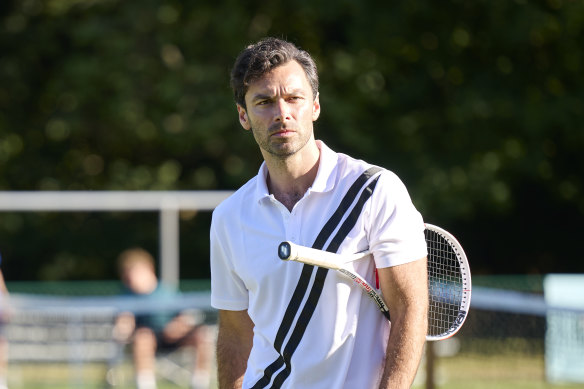 Aidan Turner as tanned, smooth-talking tennis coach Glenn Lapthorn.