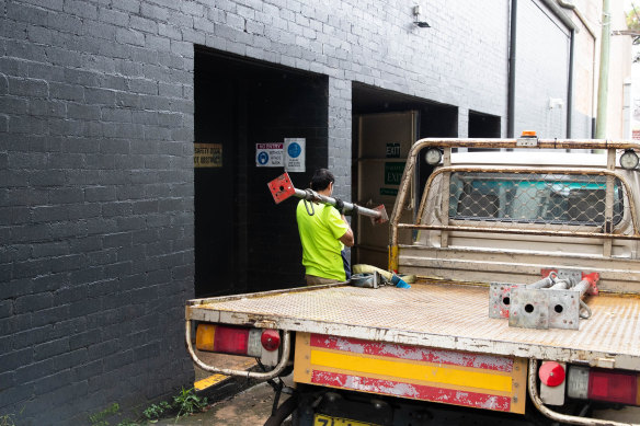 Builders bring supplies into the recently renovated Enmore Theatre after a floor collapsed during a performance.
