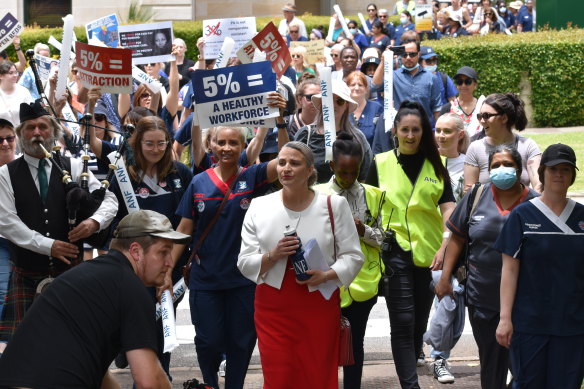 ANF secretary Janet Reah walks with protesters during Friday’s rally.