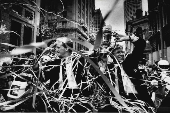 The Wallabies are swamped in a ticker tape parade in Sydney to honour their World Cup win.