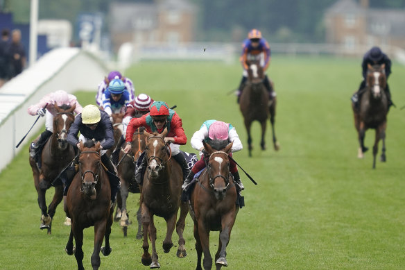 Norway, last horse on the fence,   tails off   after setting the pace in the King George V won by Enable (pink cap).