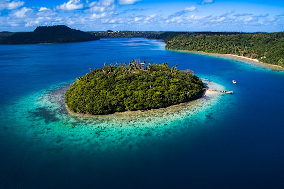 An island surrounded by a coral reef in Tonga. 
