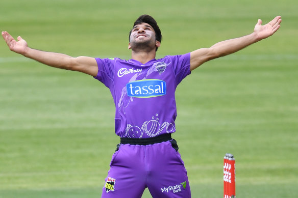 Qais Ahmad celebrates the dismissal of the Sixers' Moises Henriques during his match-winning spell on Friday.