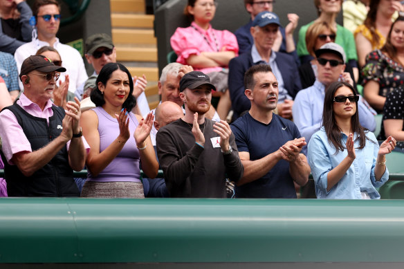 Nick Kyrgios’ team applauds during his quarter-final win.