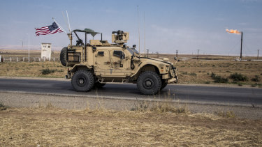 Some to remain: US forces patrol Syrian oil fields, in eastern Syria.