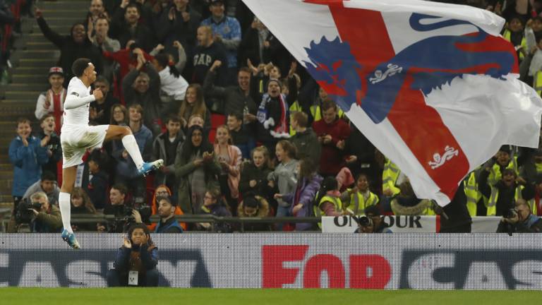 Trent Alexander-Arnold puts England's second goal in the net.