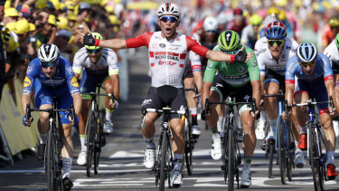 Ewan celebrates as he crosses the finish line.